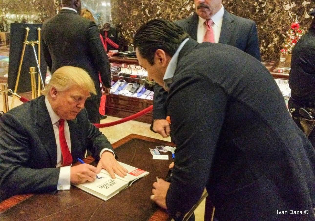 Ivan Daza pitching the Titicaco saga to Donald Trump as he signs a book at Trump Tower, New York, December 2011